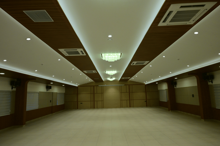 Banquet hall of Bhavanis Vista By Icon featuring an empty floor and ceiling lighting.