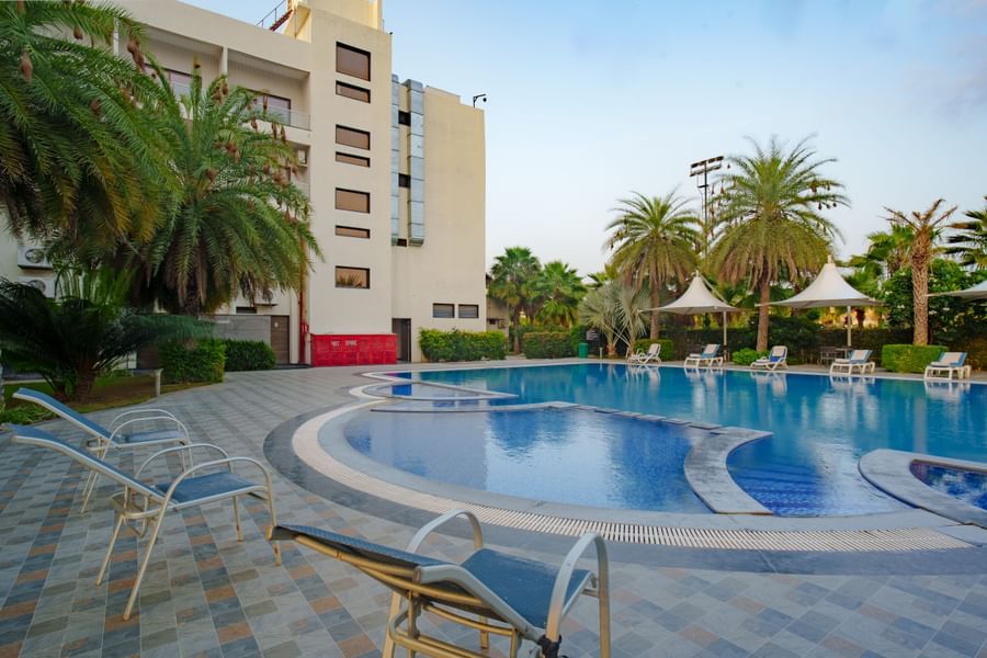 Exterior view of the hotel building overlooking the swimming pool at Arawali Ananta Elite, Jaipur.