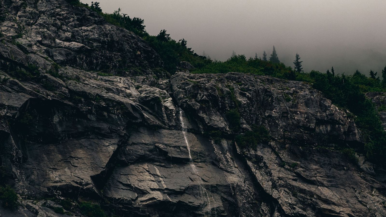 an image of the hillside boulders look majestic during late hours