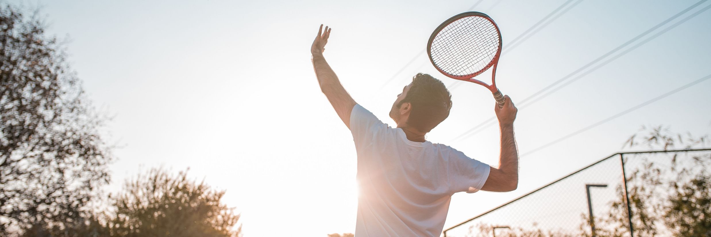 a tennis player preparing to serve 63