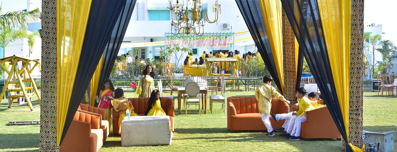 Outdoor seating lounge setup for sangeet night at Vedikant Resorts The Mallard Corbett with clear blue sky in the background.