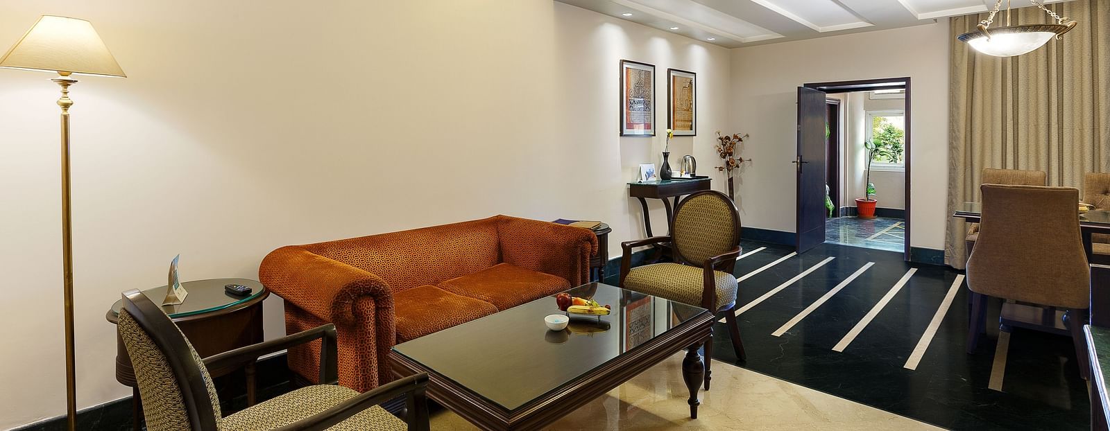 Luxurious hotel room at Ganga Lahari Haridwar, featuring a comfortable sitting area.