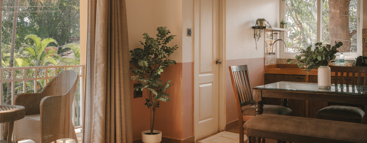 Spacious living area with a balcony view at One BHK Apartment, Richmonde Ananta Elite, Goa.