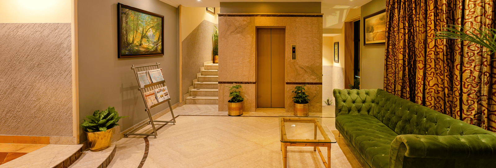 A welcoming reception area with soft lighting and elegant decor - Cross Roads Inn, Bengaluru