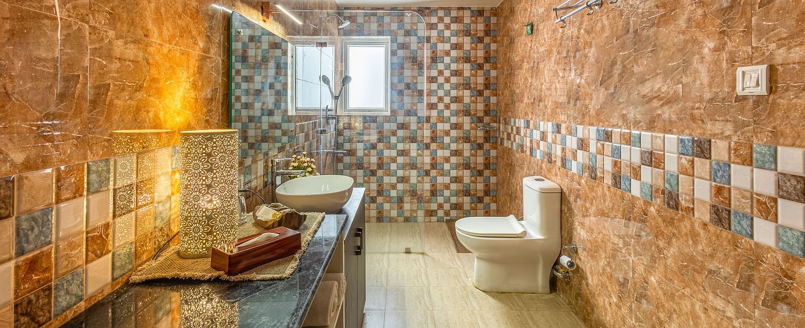 overview of the bathroom with shower area in view inside one of the rooms - Neer ganga Resorts