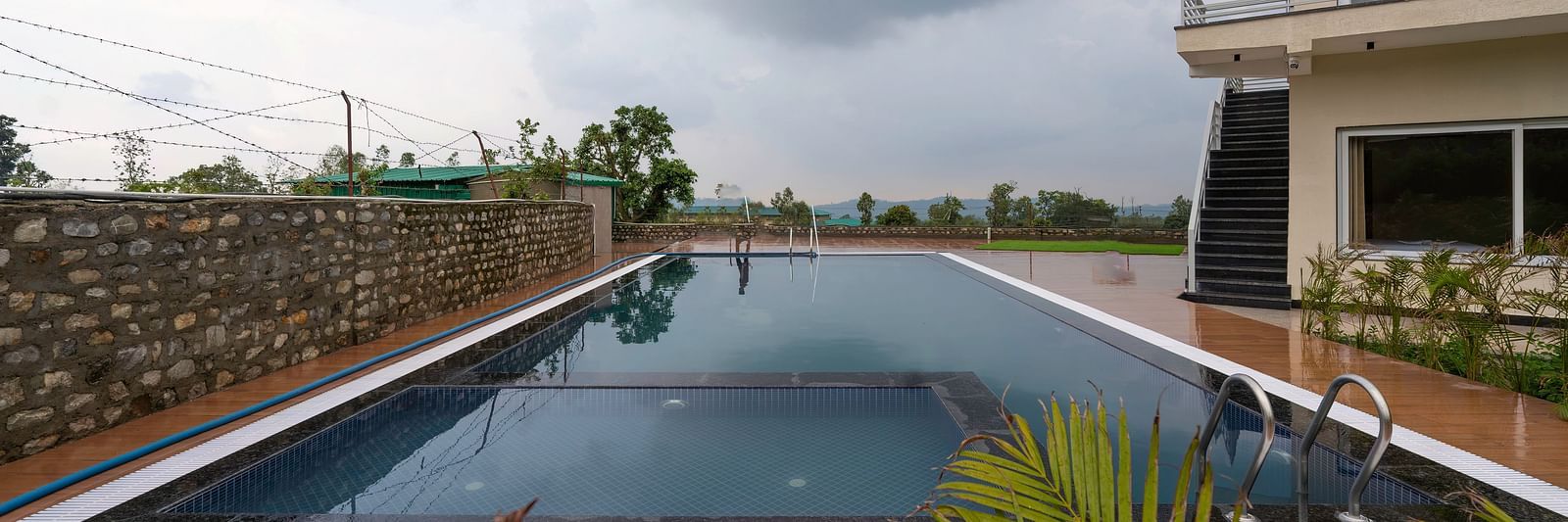 view of the swimming pool at Corbett Four Seasons, Ramnagar