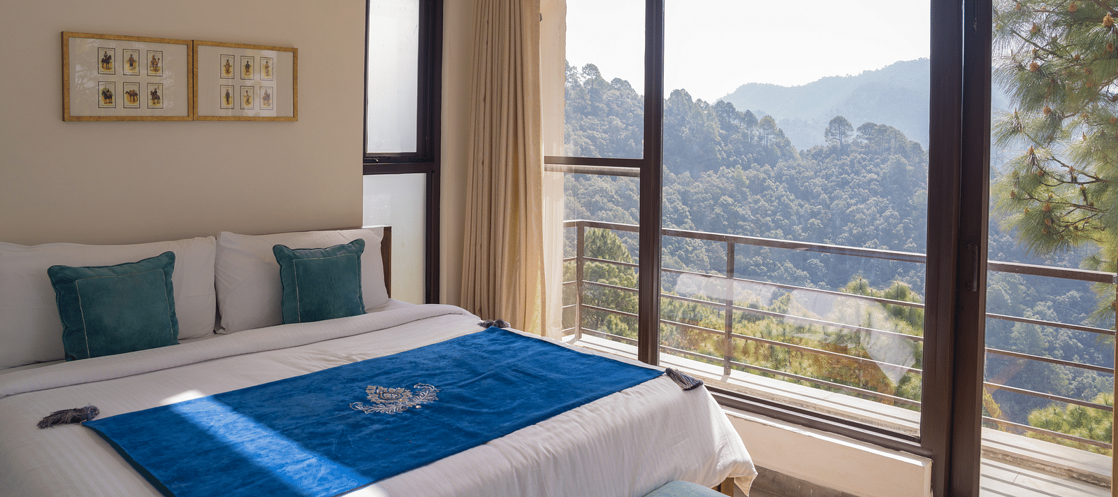 A  bedroom with pillows and a balcony at BluSalzz Escapade Resort, Lansdowne