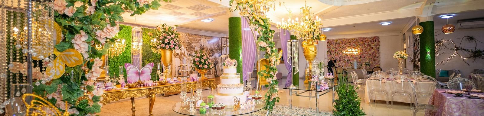 image of an entrance at KertelSuites, Kinshasa decorated with beautiful flowers and warm lighting