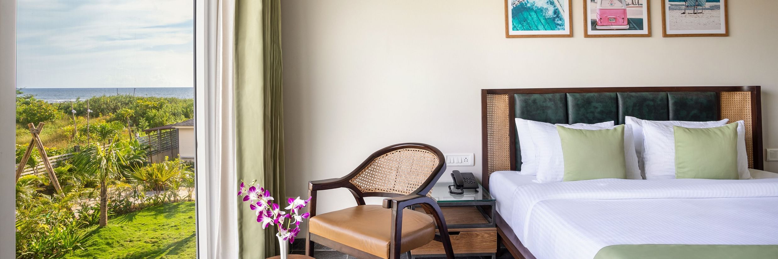 Premium Suite that features a queen size bed along with an arm chair with beautiful views from the window besides it