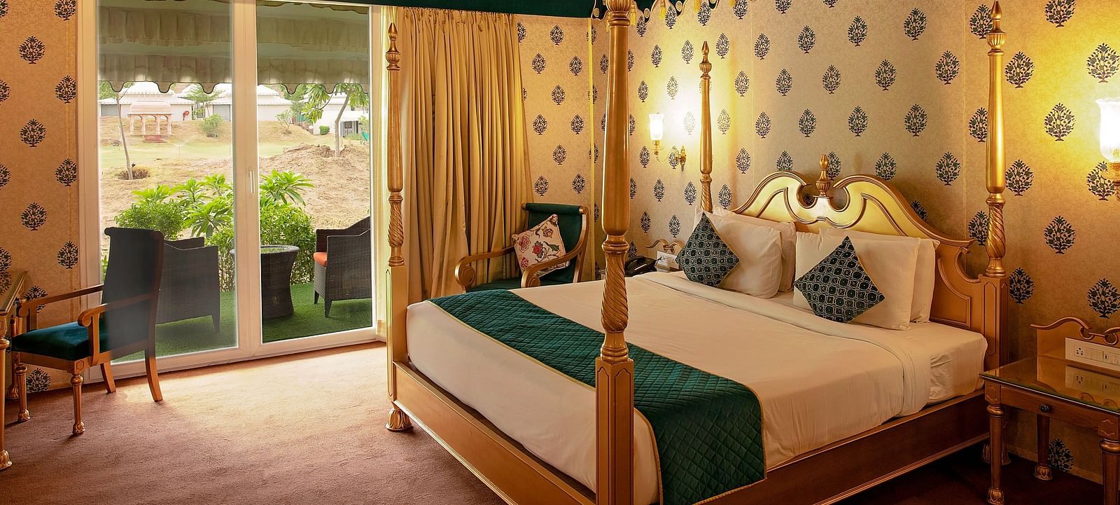 Image of Royal Luxury Tent a bed and an attached balcony on the side at Rajasthali Resort & Spa Jaipur.