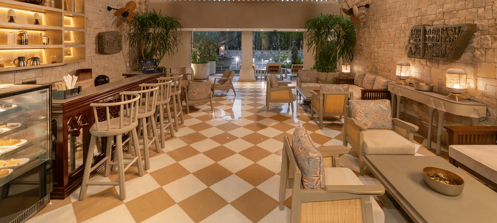 Full view of the Suenos de Cafe featuring a beautiful chandelier hanging from the ceiling.