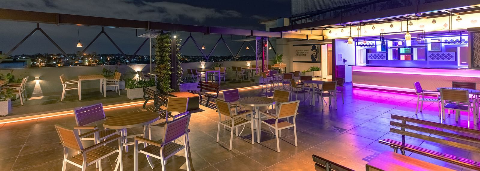 An image of a dining space with tables and chairs, complemented by an open roof at M Pro Palace.