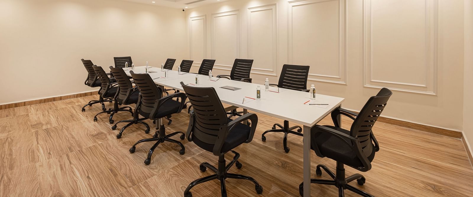 Spacious boardroom with executive chairs arranged in a U-shape at Lemonridge Hotels, IDPL Balanagar.