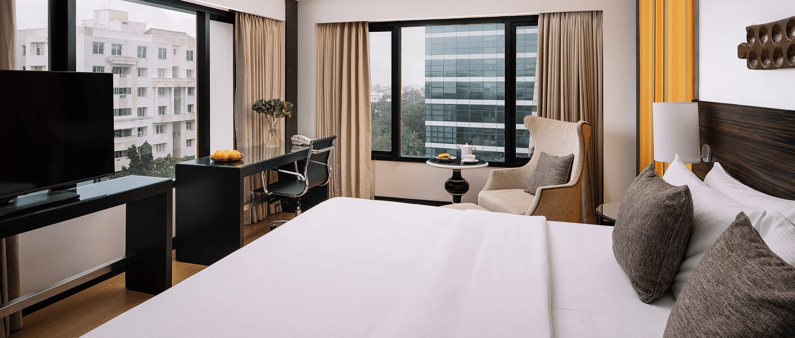 Image of Deluxe Room at The Raintree St. Mary s Road with a bed and a sofa
