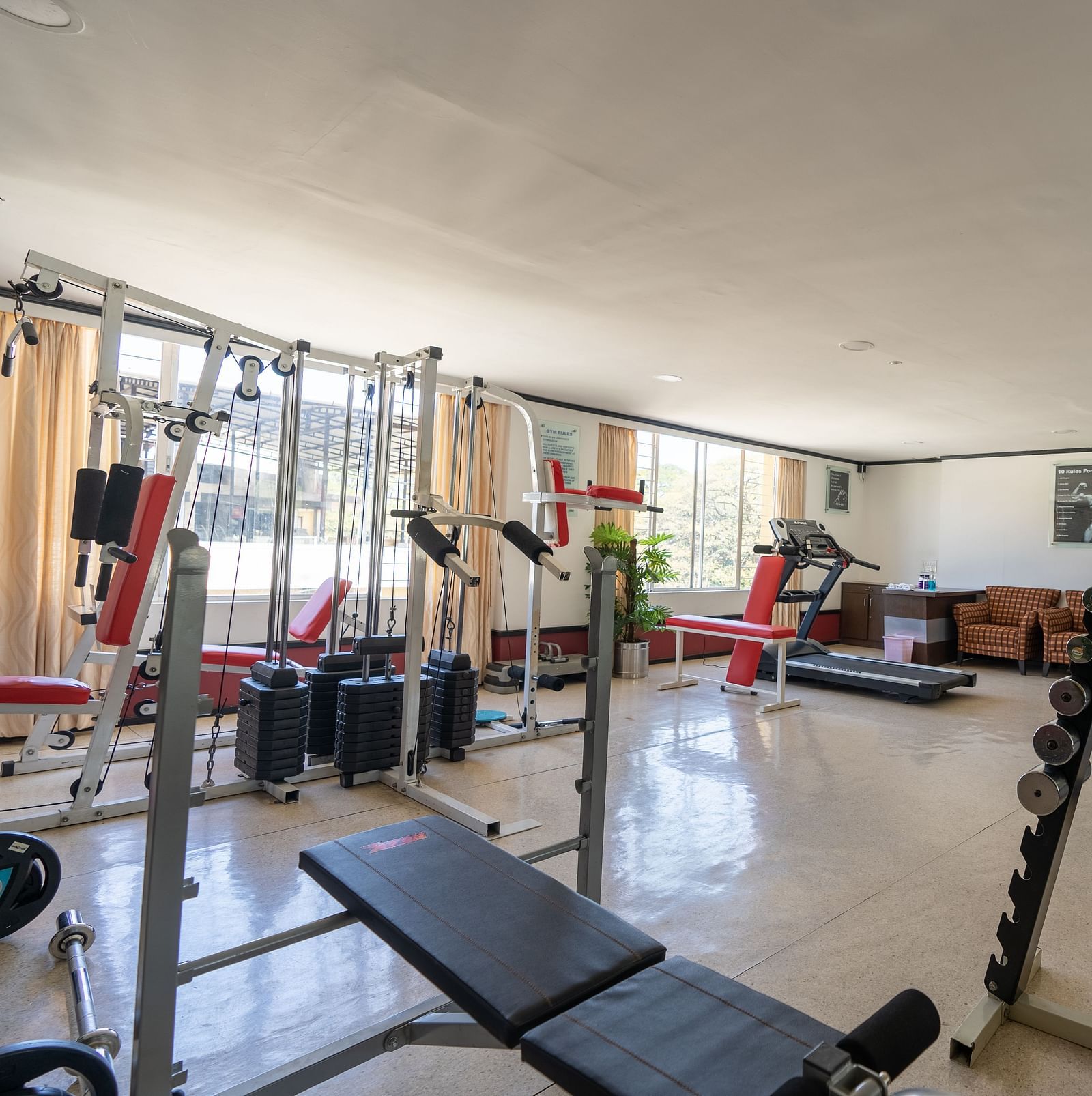 overview of the gymnasium with modern equipment inside - Hotel Pai Vista, Mysore