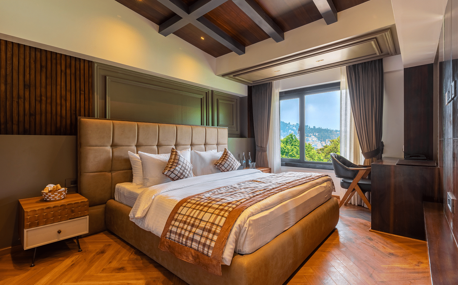 A bedroom with mountain view window at Bedzzz Xclusiv Ikshana Luxe