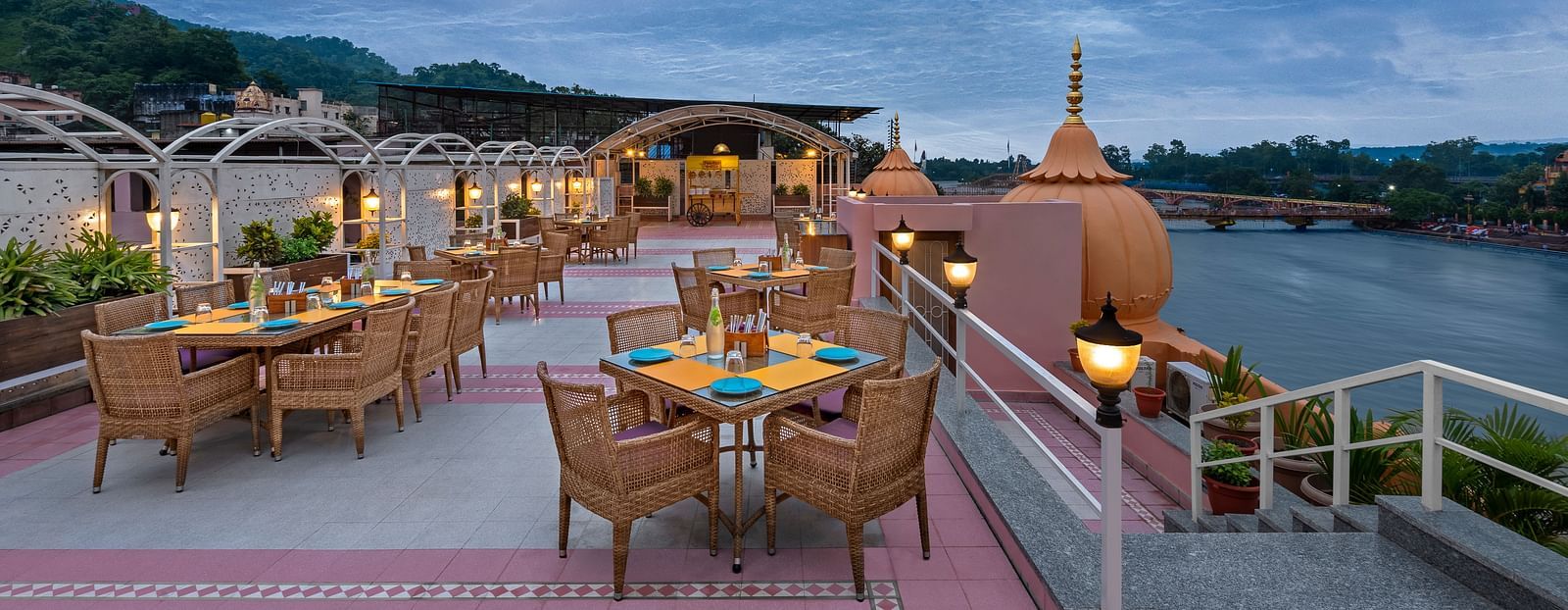 Enjoy a panoramic view of the Ganges River from the rooftop restaurant at Ganga Lahari Haridwar.