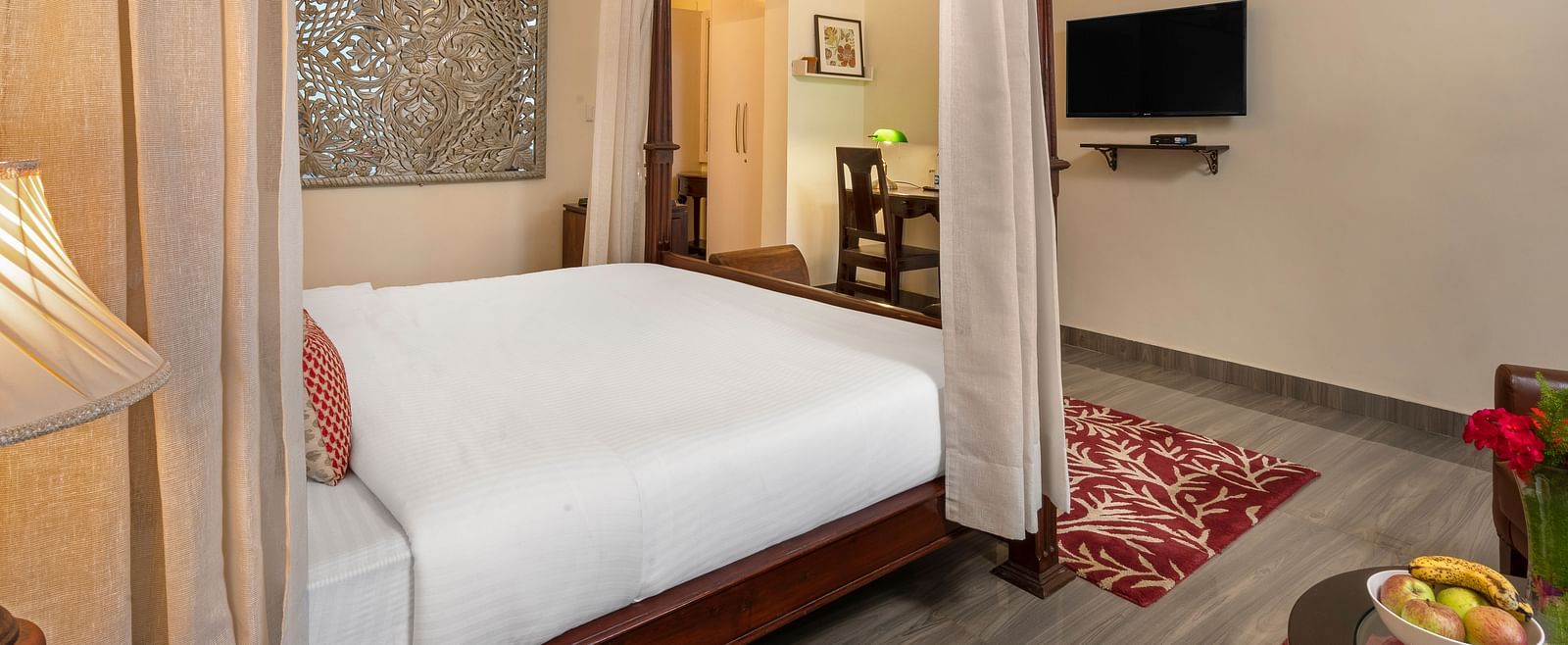Comfortable suite with elegant furnishings, canopy bed, and flat-screen TV, at BluSalzz Collection - Suvaasa Resort, Ramgarh.