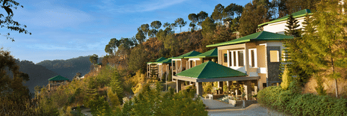 A picturesque mountain resort surrounded by lush trees, featuring stunning views of the mountains and valleys, perfect for a tranquil getaway