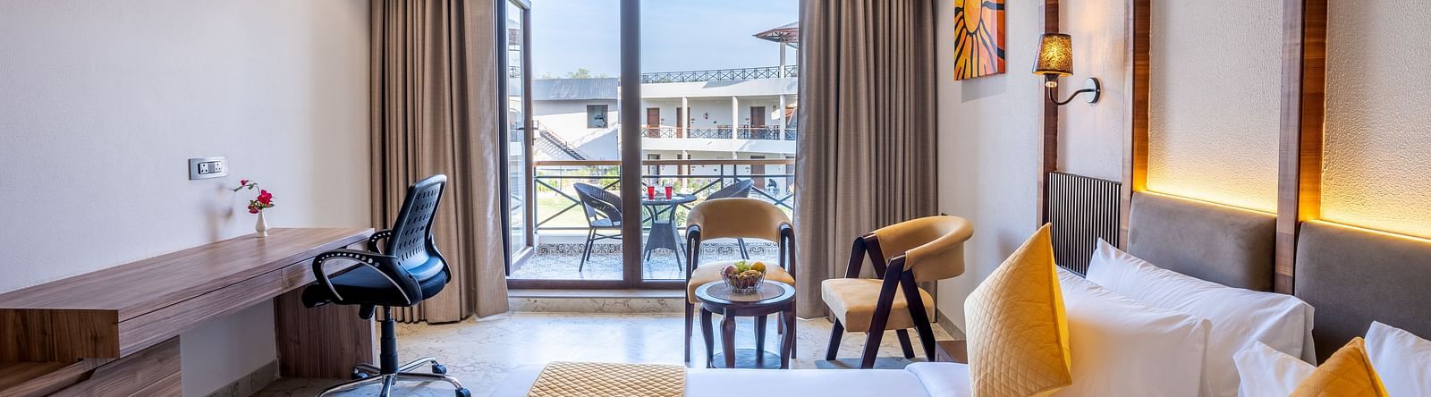 view of the deluxe room with king size bed and a view with a working space 