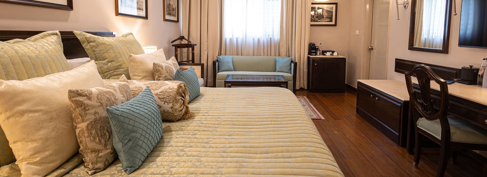 Image of a large bedroom featuring a king-size bed in our boutique rooms - The Claridges New Delhi