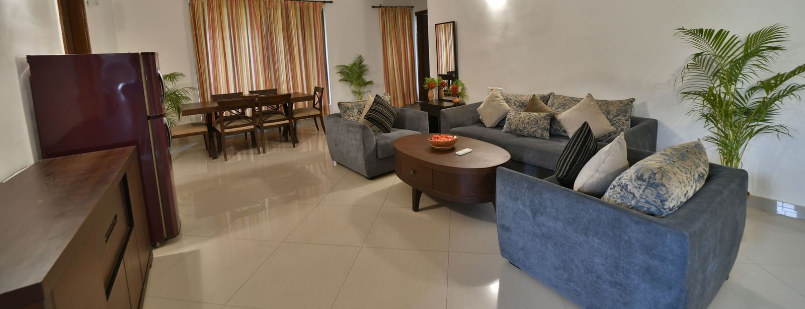 A wide shot of the interior living room, showcasing the seating arrangement and decor | Aqua Bungalow | Vedic Village Spa Resort, Kolkata