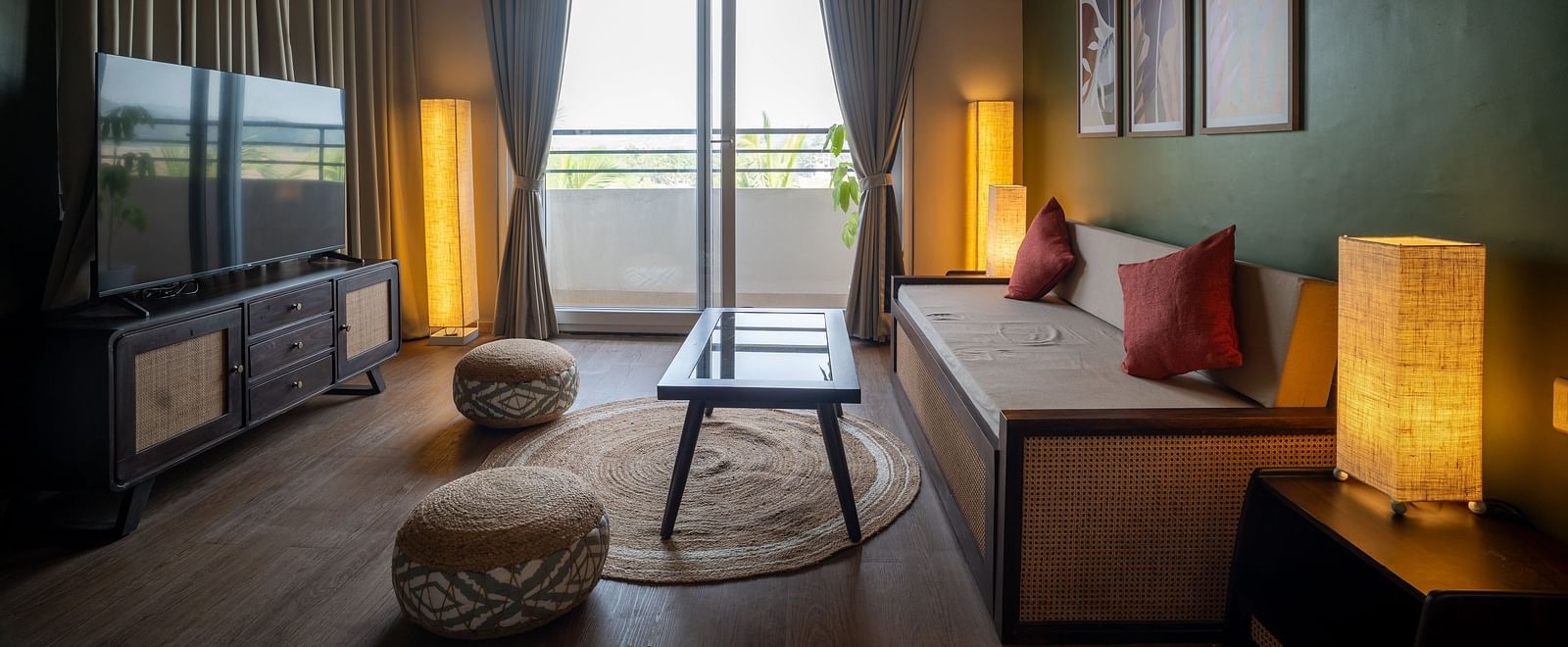 Stylish bedroom with modern furnishings, soft lighting, and balcony access at Kssemya.