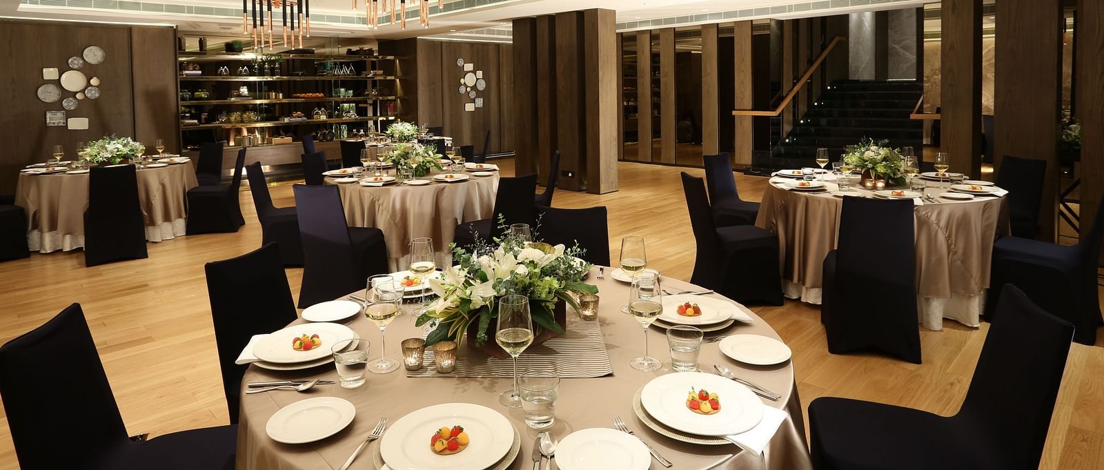 A stylish banquet hall with elegant table settings, ideal for upscale events at The Raintree, St. Mary's Road