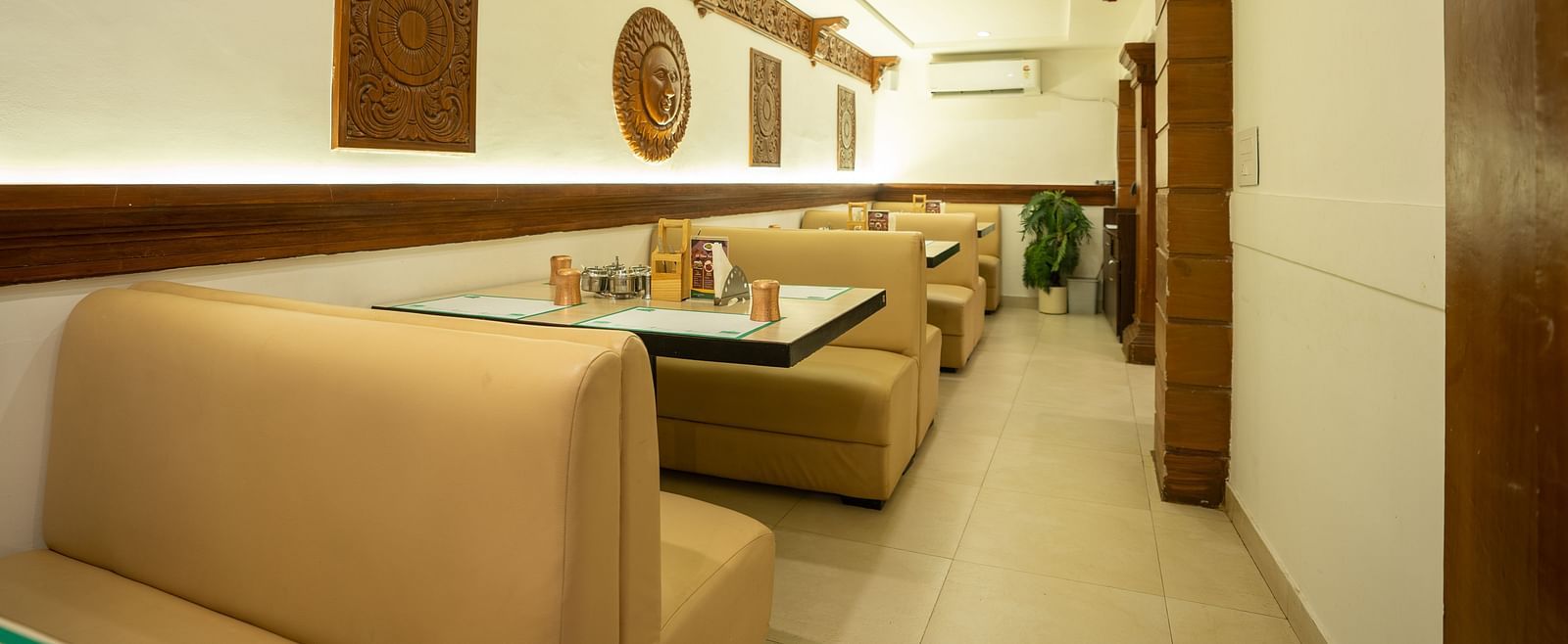 Restaurant seating arrangement - The President Hotel, Hubli