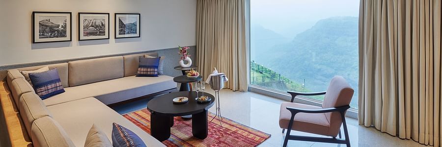Image of a sitting area with a large window overlooking the valley at The Dukes Retreat.