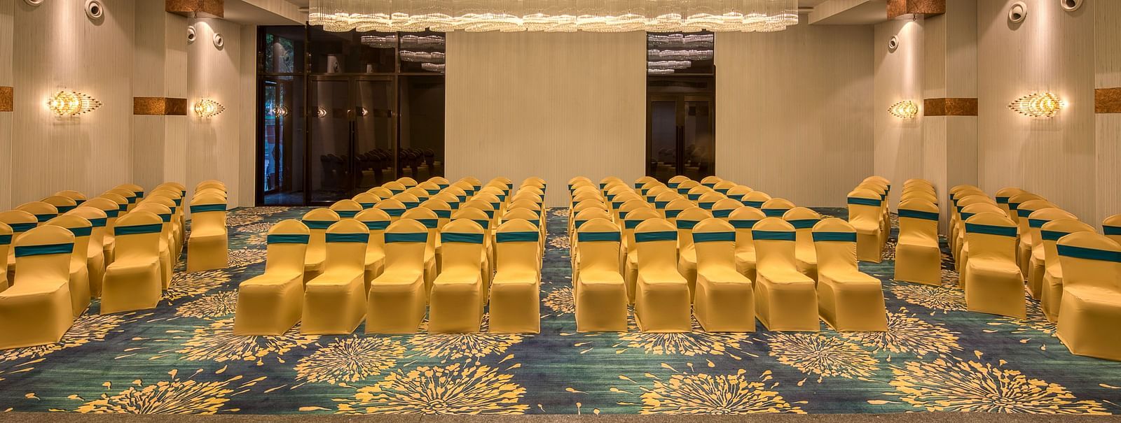 Yellow coloured chairs in the Sumo Anaika Banquet Hall at Le Foliage by TGI, Bangalore
