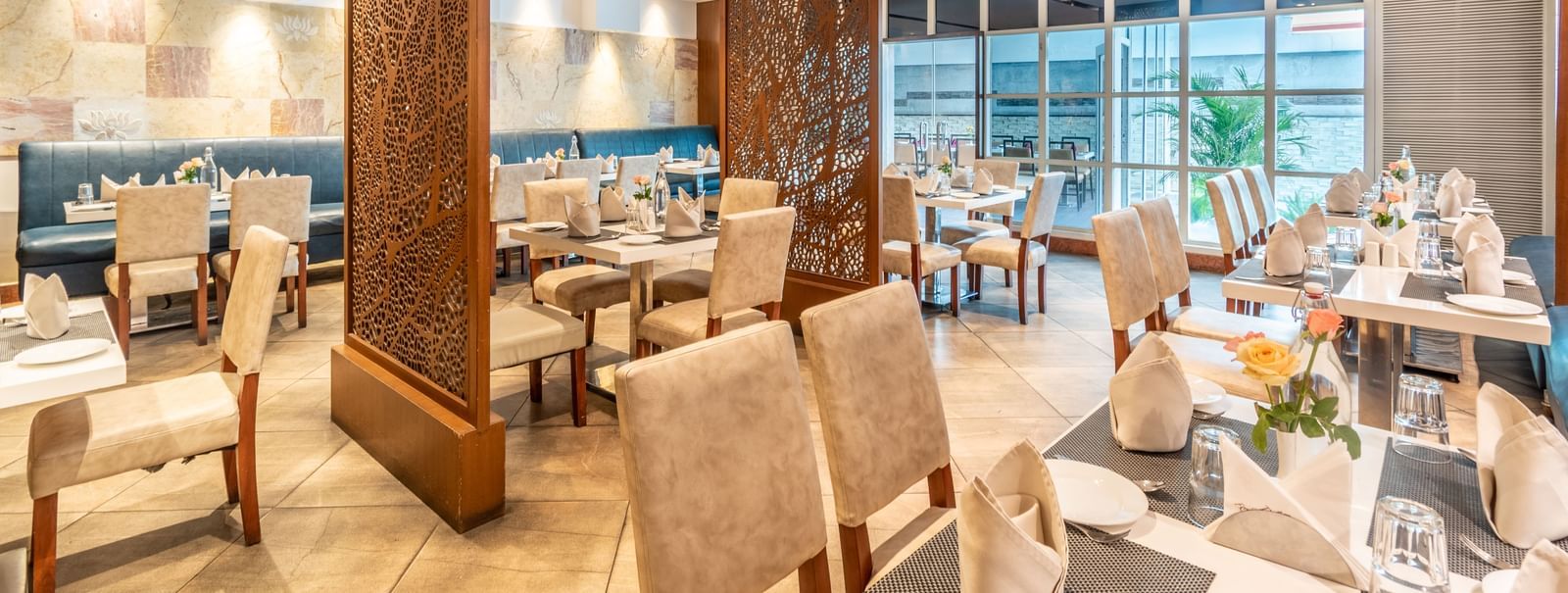 Elegant restaurant layout with decorative partitions and cosy seating- TGI Grand Fortuna, Krishnagiri Main Road, Hosur