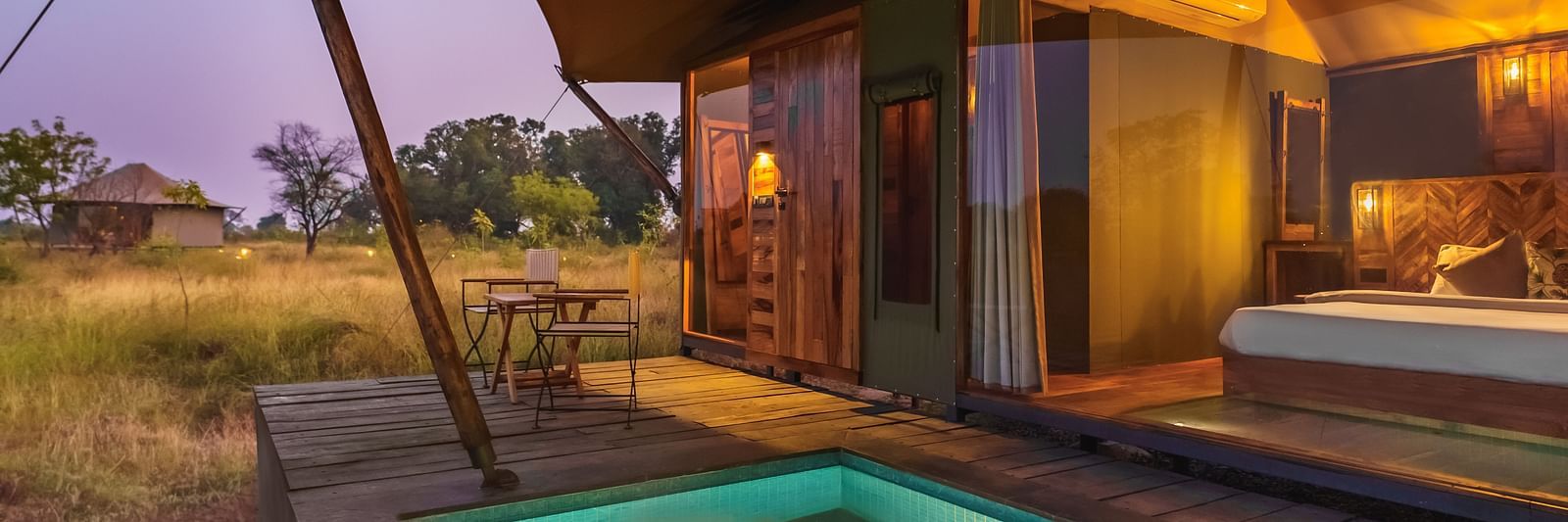 A view from outside of a tent with a plunge pool at Trees N Tigers, Tadoba.