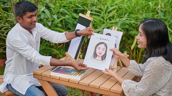  A person drawing a caricature of a woman on a piece of paper at The Dukes Retreat