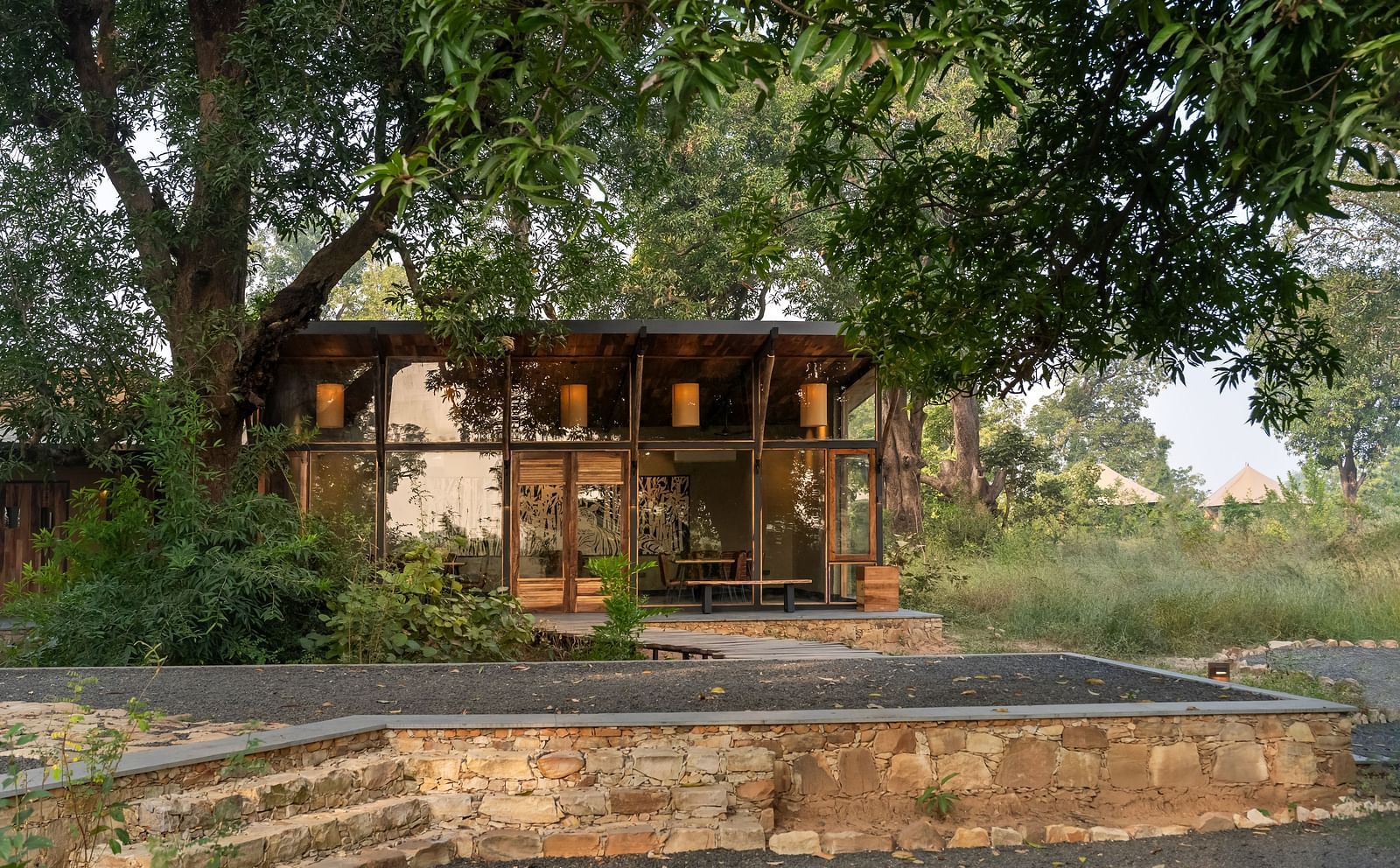View of a hut amongst greenery at Trees N Tigers, Tadoba.