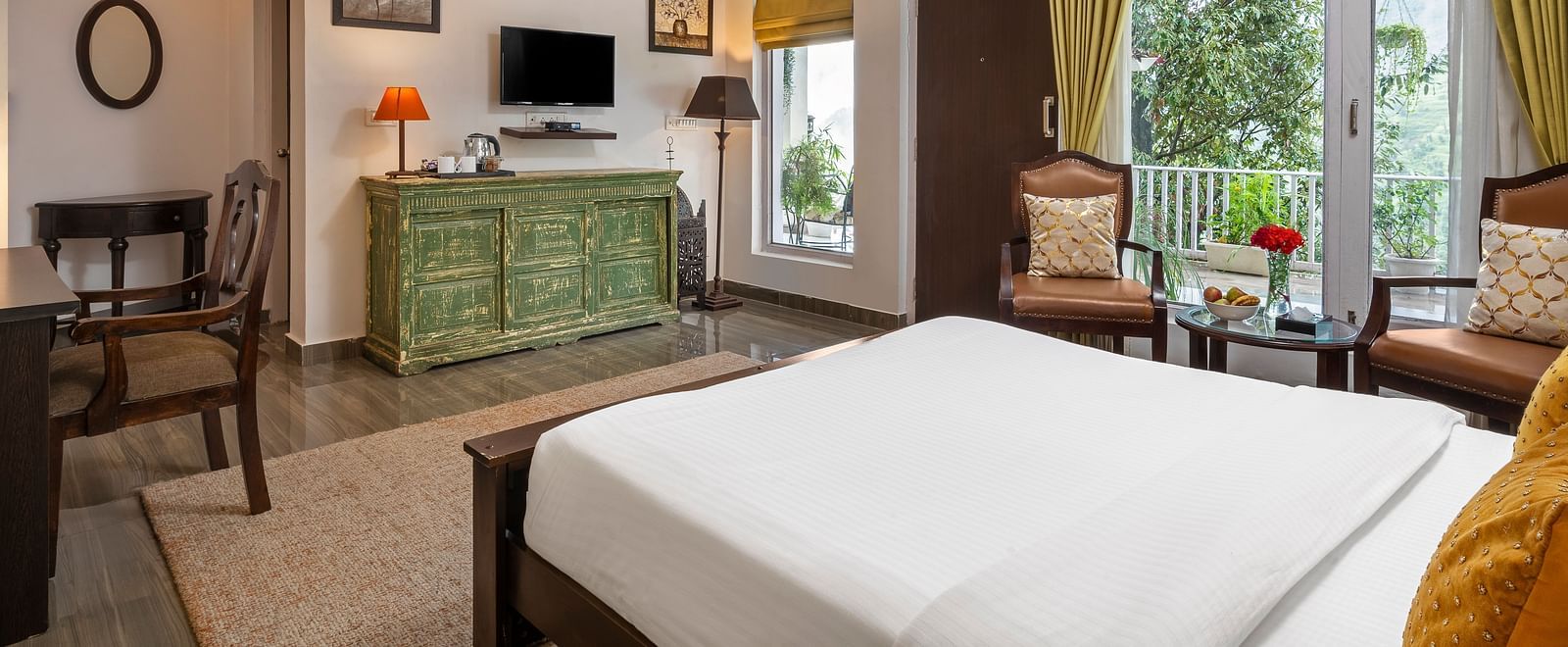 Bright and elegant guest room with large windows, wooden furniture, and modern decor, at BluSalzz Collection - Suvaasa Resort, Ramgarh.