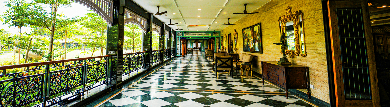 Elegant corridor with black and white checkered flooring at MAYFAIR Oasis Resort and Convention Jharsuguda