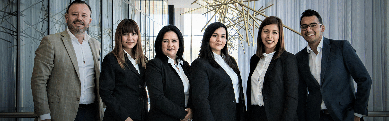 An image of a group of people dressed in formal outfits