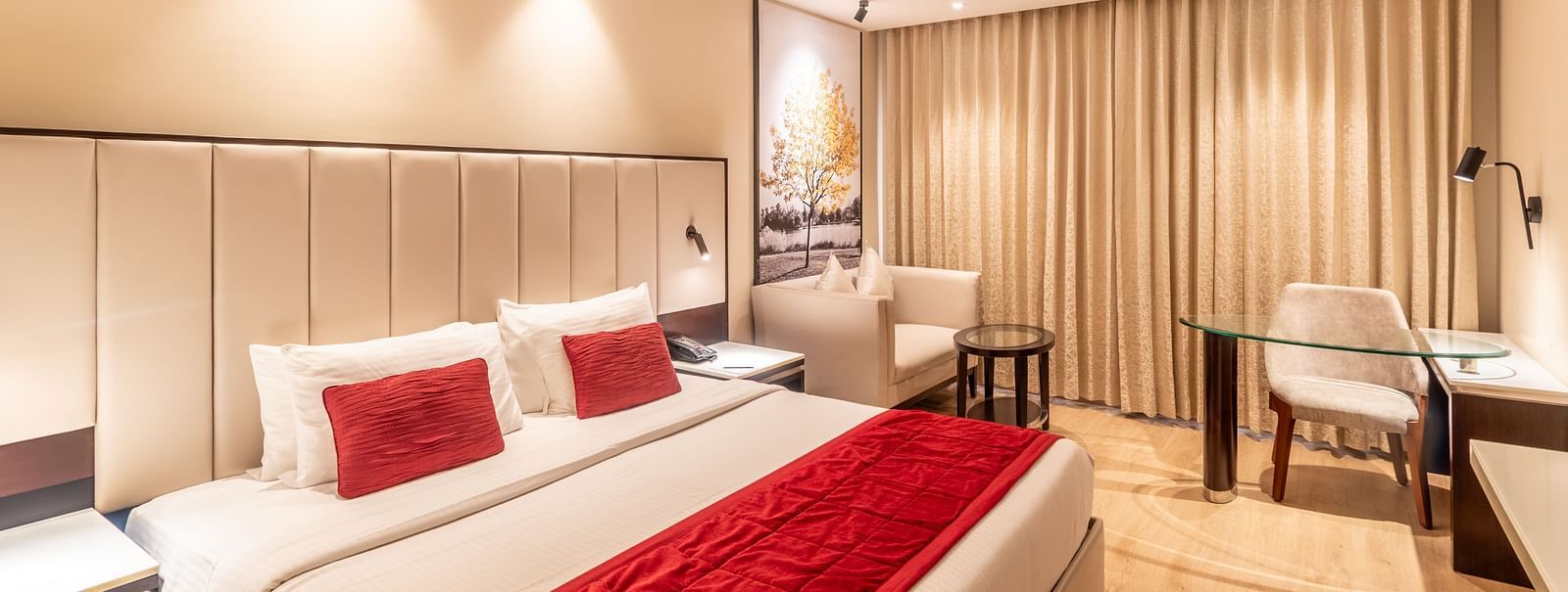 Spacious hotel room with double bed, work desk, and armchair - TGI Grand Fortuna, Krishnagiri Main Road, Hosur