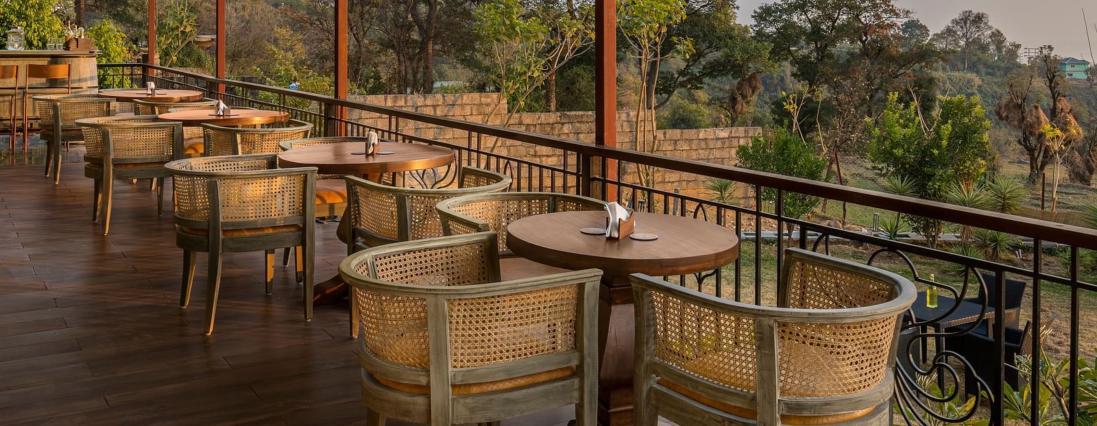 An image of Atman, dharamshala cafe terrace with stunning views of the surrounding hills.