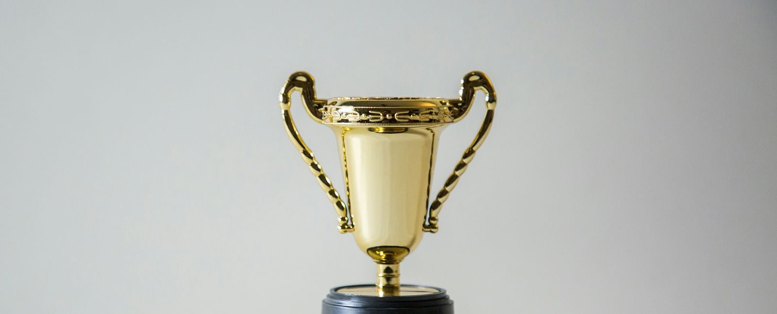A gleaming golden trophy, symbolizing excellence and achievement