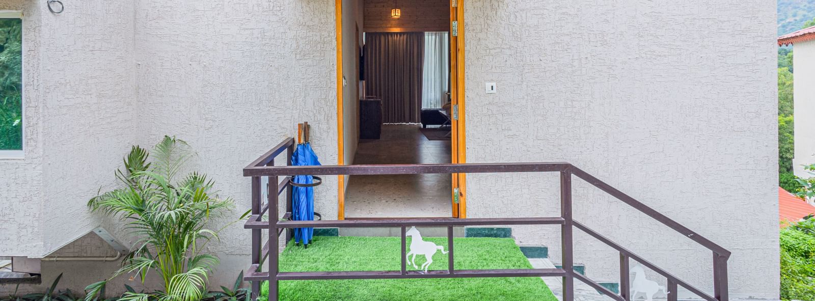 Entrance of Sajjan Villa at Bamboo Saa Resort and Spa, Udaipur featuring stairs leading to a room.