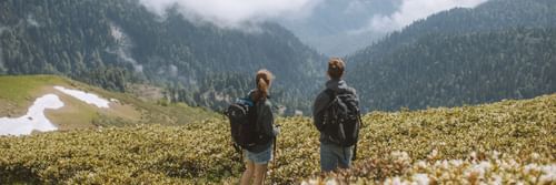 A couple having a great time looking over mountains