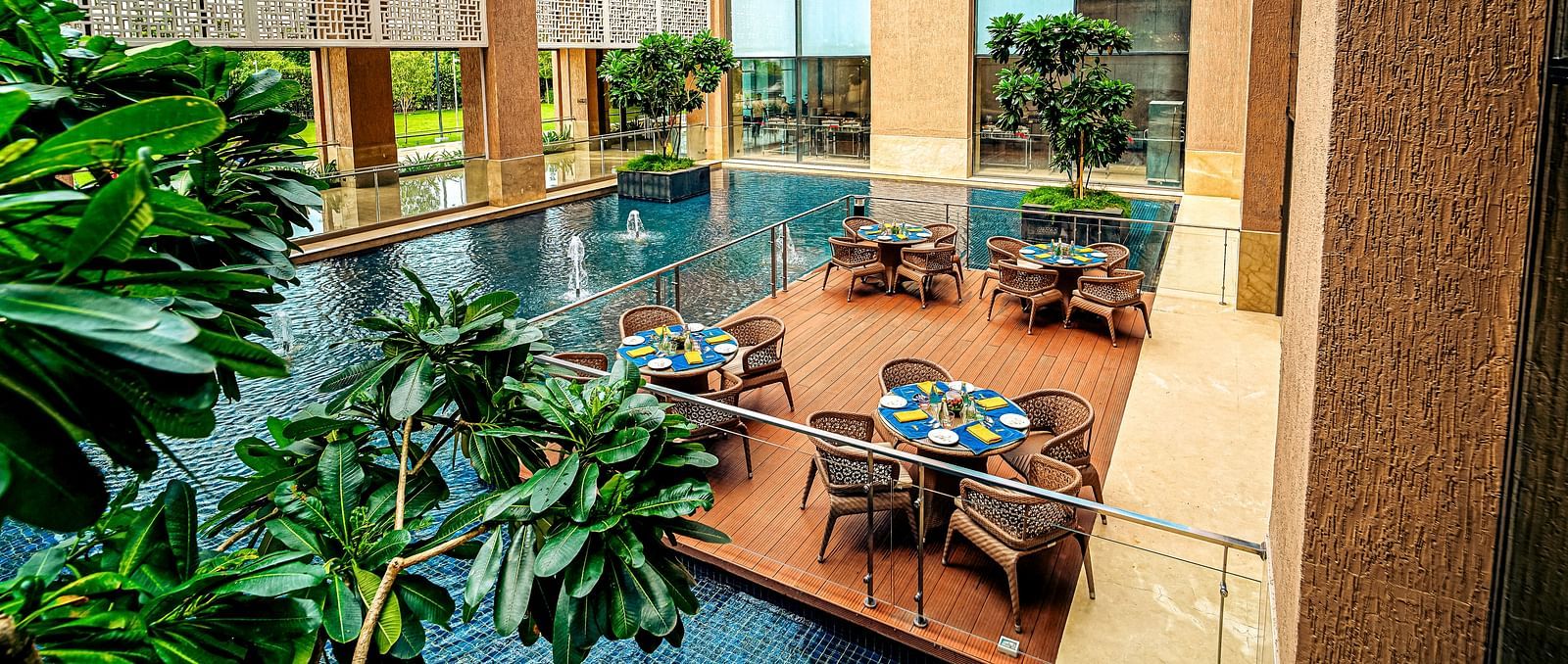 A stunning outdoor dining area with water features and natural light, creating a tranquil dining experience