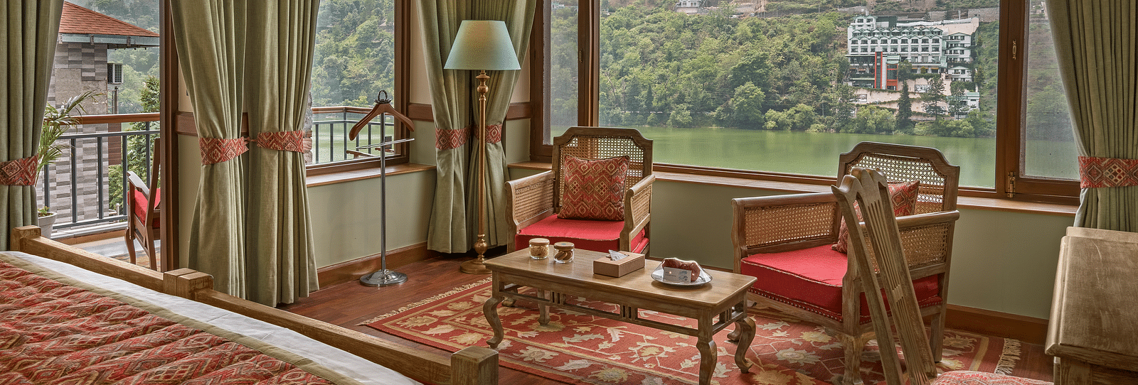 An interior picture of Superior Lake Facing Rooms with balcony and carpet flooring- Leisure Hotels