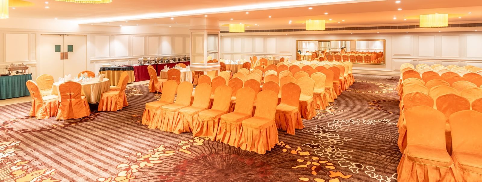 Spacious hall set up in classroom-style seating, ideal for training sessions or workshops