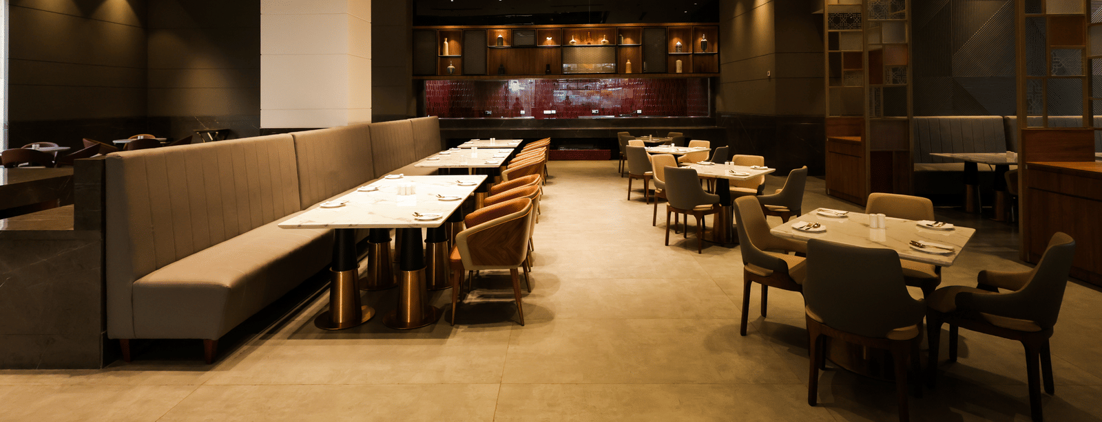 Spacious restaurant with wooden interiors and multiple dining tables at Ramada by Wyndham Sonipat Murthal