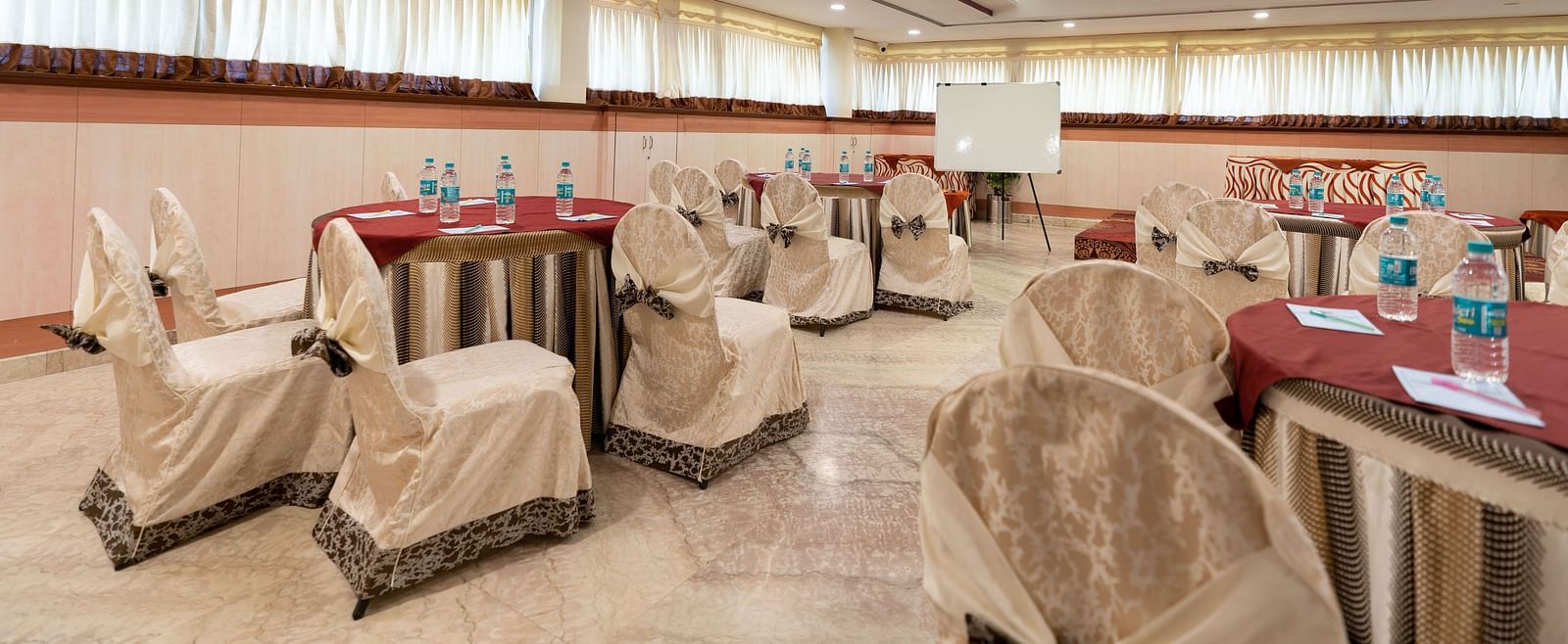 Seating arrangements inside the banquet hall - Hotel Pai Comforts, JP Nagar