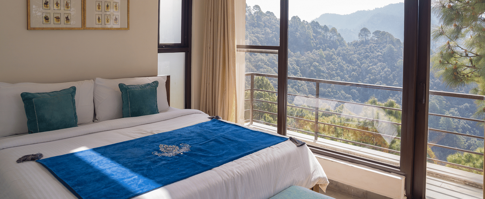 A  bedroom with pillows and a balcony at BluSalzz Escapade Resort, Lansdowne