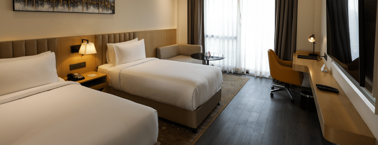 Room with ambient lighting and artwork at Ramada by Wyndham Sonipat Murthal